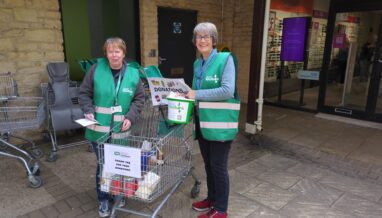 two people with a shopping trolley